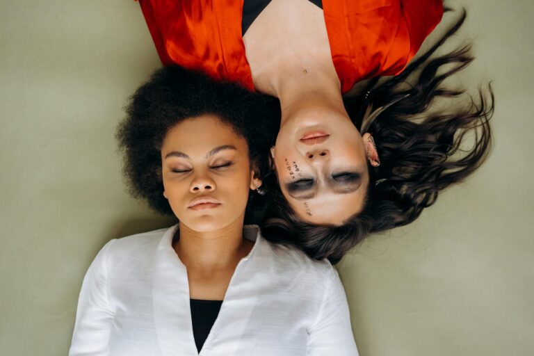 Woman in White Shirt Beside Woman in Red Shirt